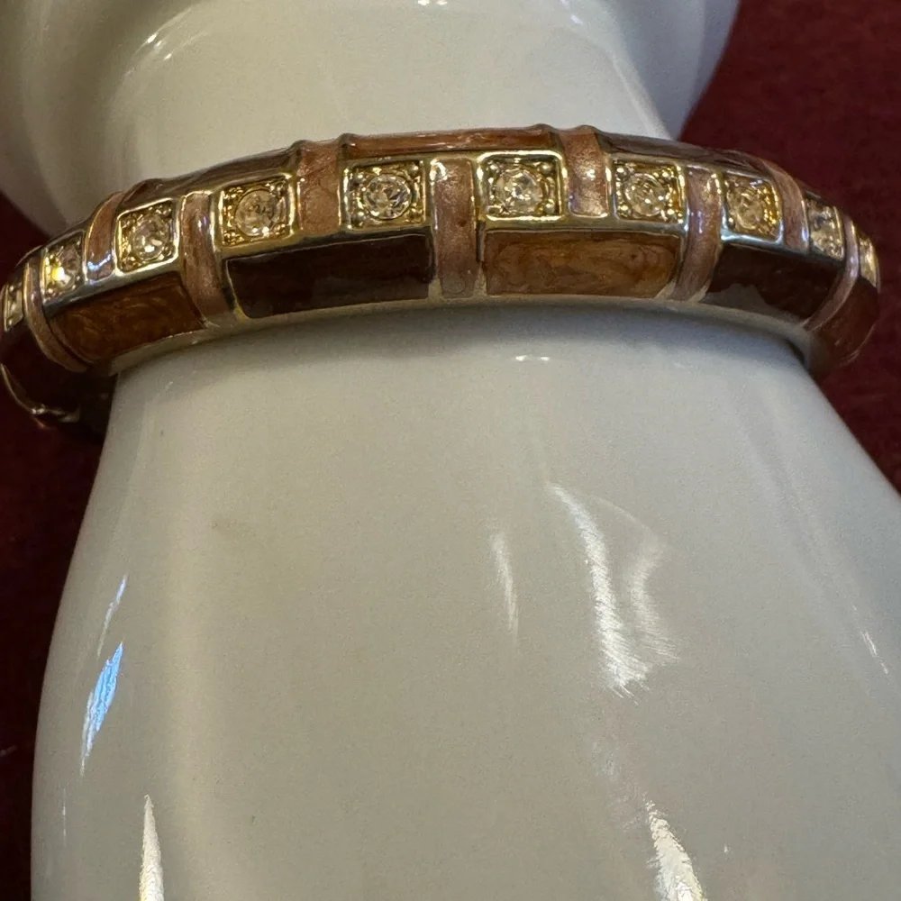 Gold tone with brown and caramel enamel hinged bracelet w/rhinestone accents